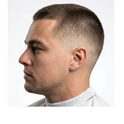 Buzz cut with low taper for men featuring short buzzed hair and clean tapered sides